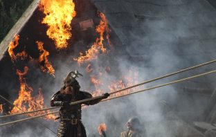 viking in front of a burning building